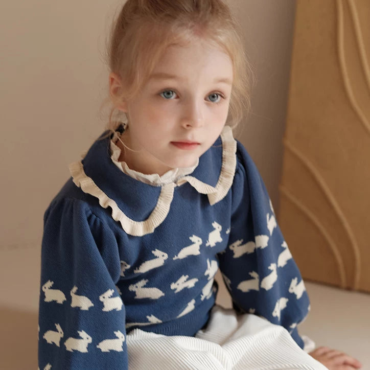 Close-up of the bunny jacquard knit and frilled collar