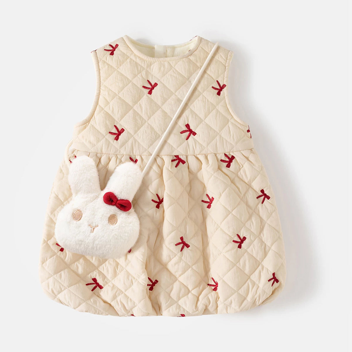 Cream quilted pinafore dress with red embroidered bows and fluffy bunny crossbody bag