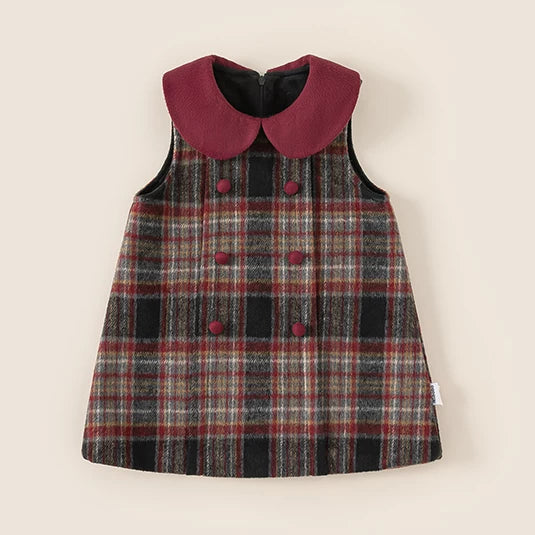 Red and grey plaid pinafore dress with burgundy Peter Pan collar, flat lay
