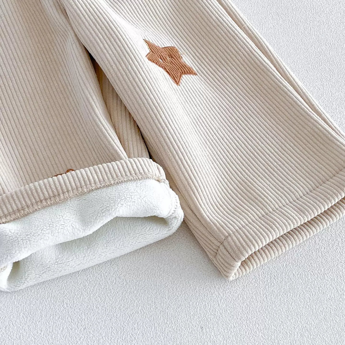 Ribbed cord texture and warm fleece lining detail