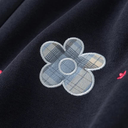 Blue plaid flower appliqué detail on girls sweatpants
