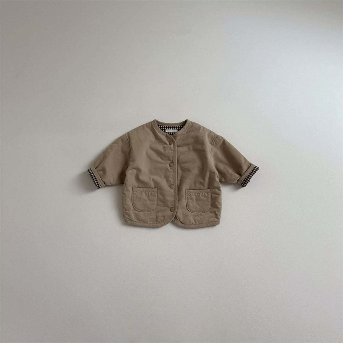 Mocha reversible toddler jacket with patch pockets, flat lay