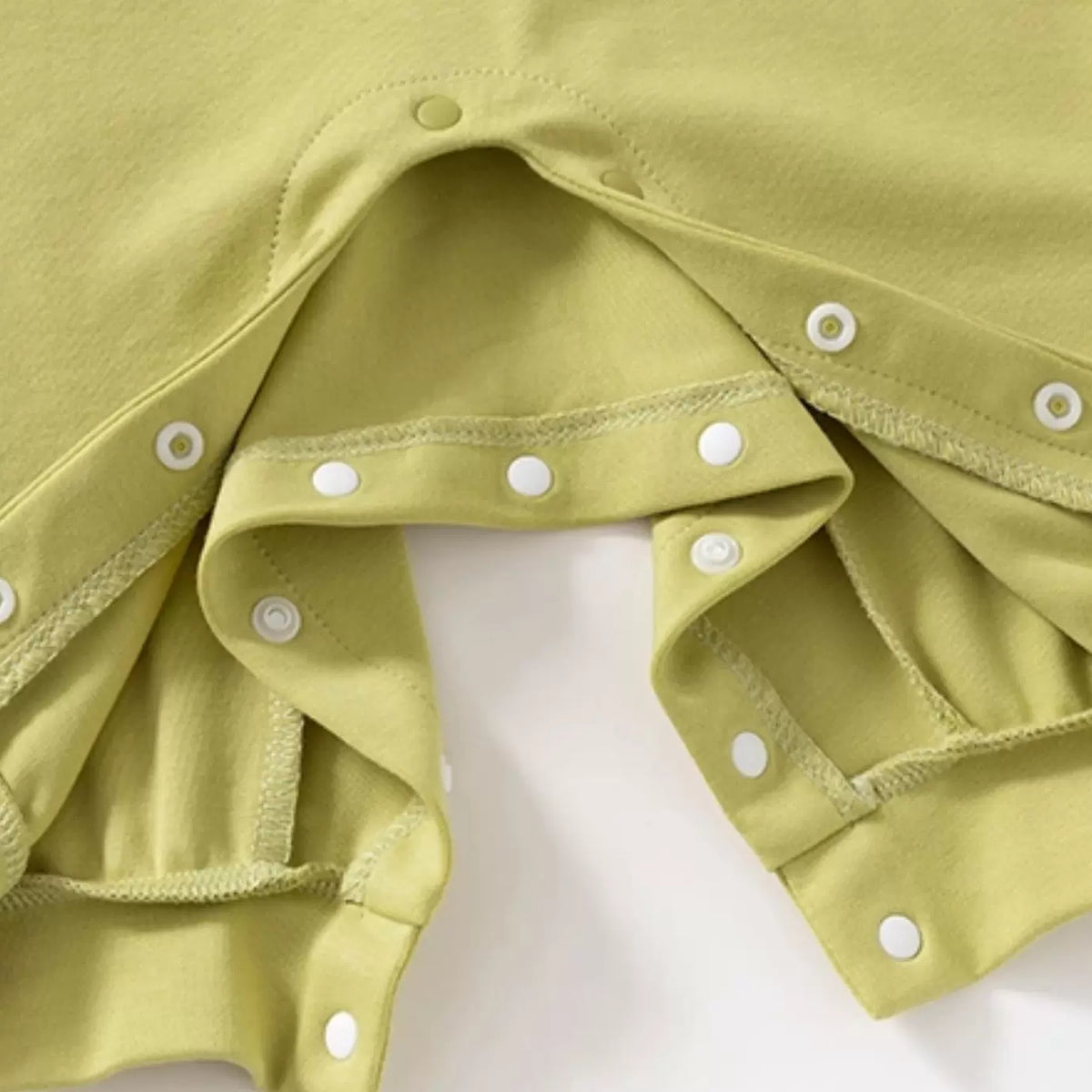 Snap opening along the legs for easy nappy changes