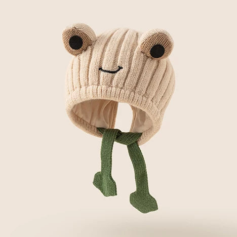 Oat frog knit baby hat with green frog-leg ties
