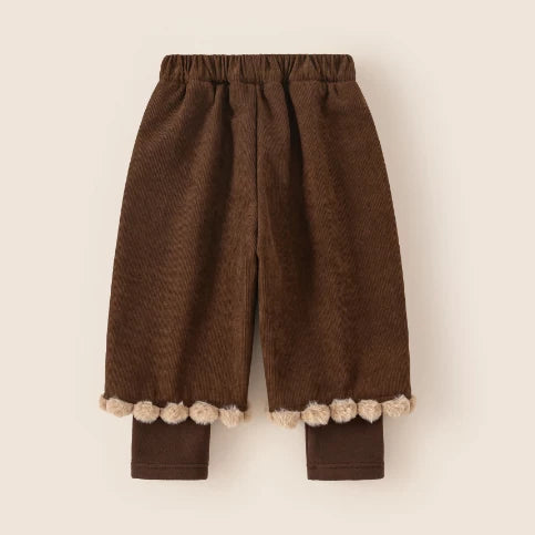 Back view of cocoa corduroy pants with pompom trim
