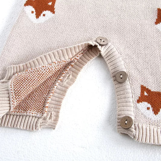 Button-up legs on fox knit baby overalls for easy changes
