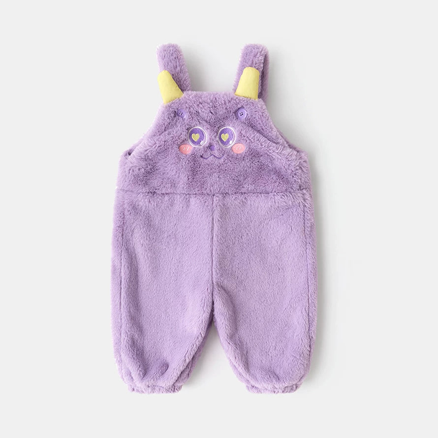 Lilac plush kids overalls with a sleepy monster face, flat lay