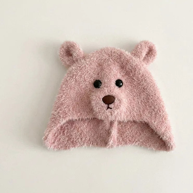 Rose pink fluffy bear hat with button eyes, flat lay