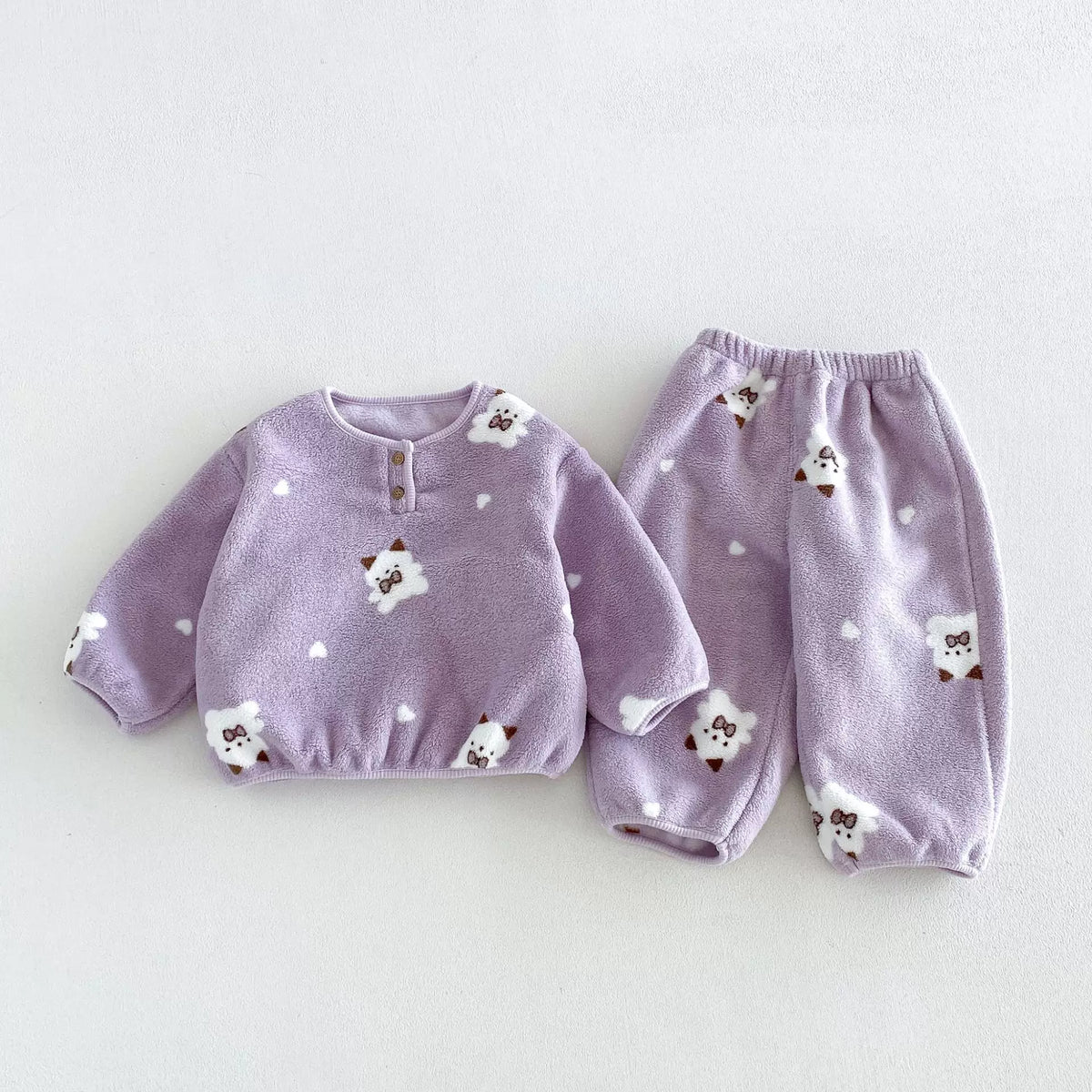 Lilac cat print fleece pajama set with heart pattern, flat lay
