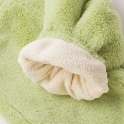 Turned-back cuff showing the soft fleece lining of green plush overalls
