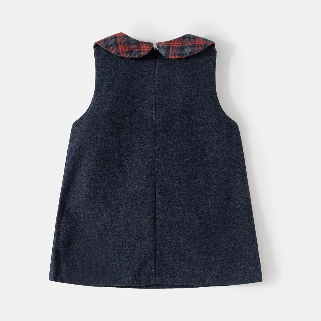 Back view of the navy pinafore dress with plaid collar
