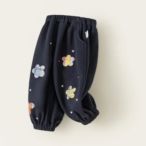 Side view of navy girls jogger pants with slant pockets