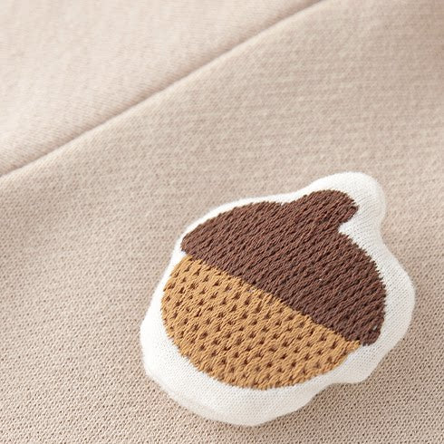 Close-up of the padded embroidered acorn patch
