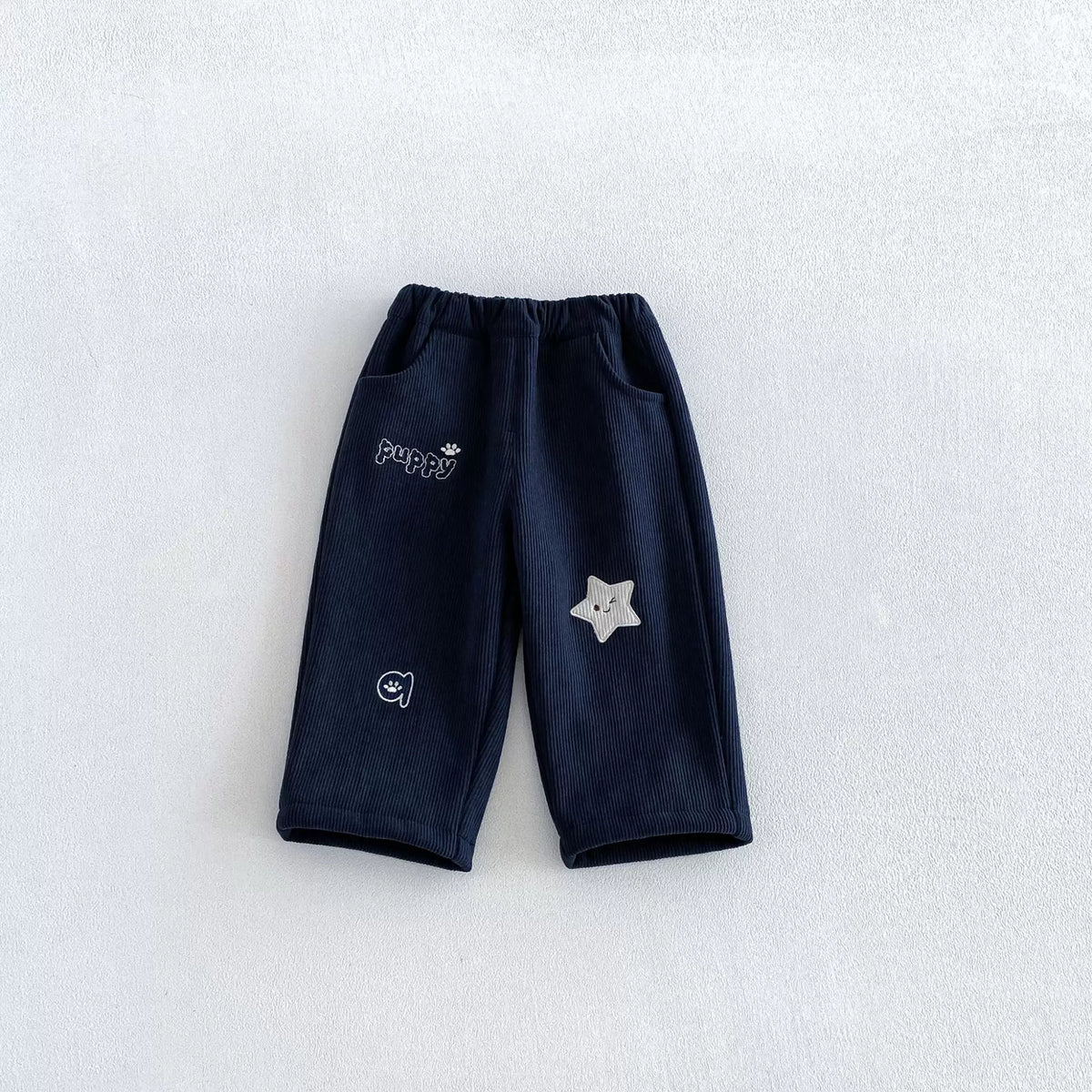 Sapphire navy fleece-lined toddler cord pants with white star