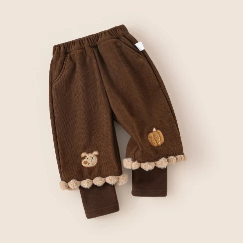 Cocoa corduroy kids pants with layered cuff, angled flat lay