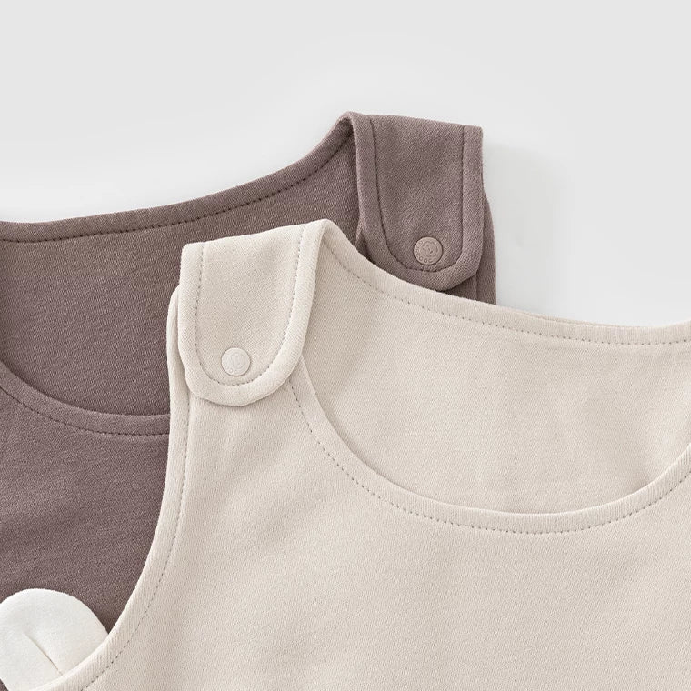 Wide shoulder straps with snap buttons on mocha and almond overalls