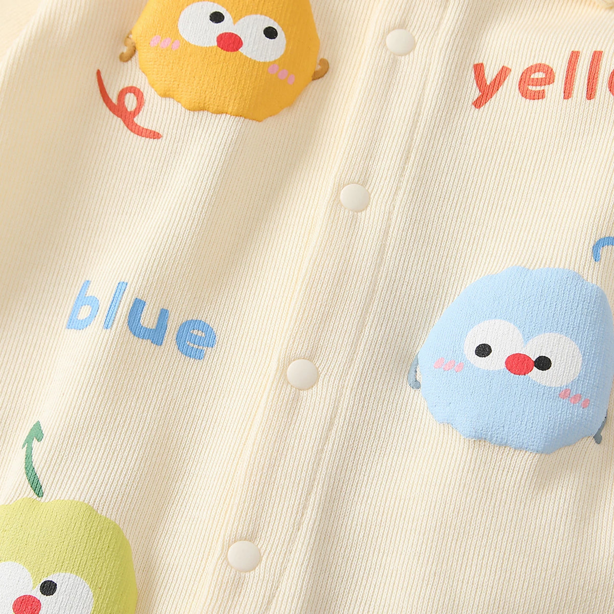 Close-up of the fluffy 3D chick appliqués on the cream baby romper