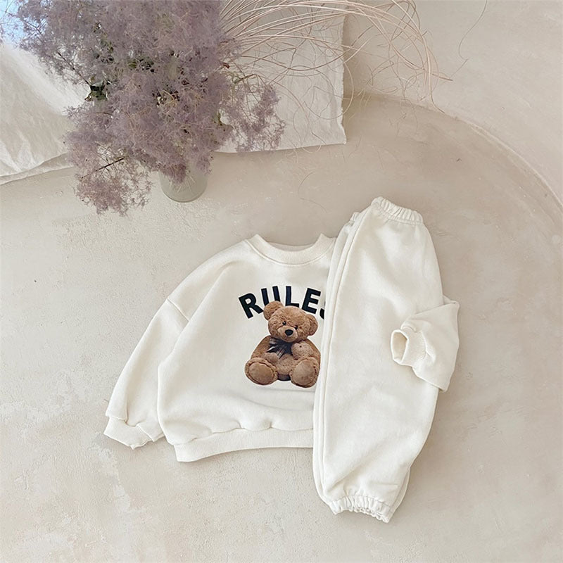 Cream bear print sweatshirt and joggers flat lay, baby two piece set