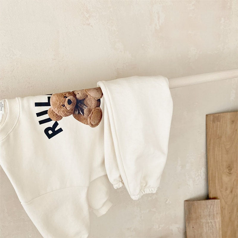 Cream teddy bear print sweatshirt and jogger set hanging, baby loungewear