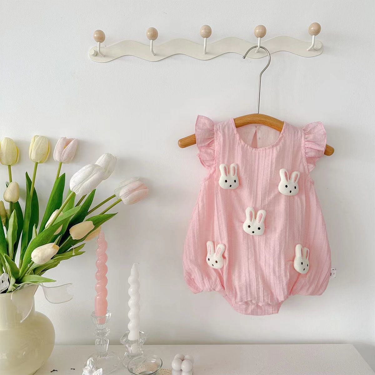 Pink baby bubble romper with 3D bunny ear appliqués for Easter spring outfit