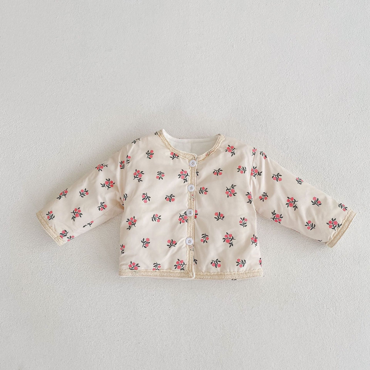 Apricot floral padded jacket on white background