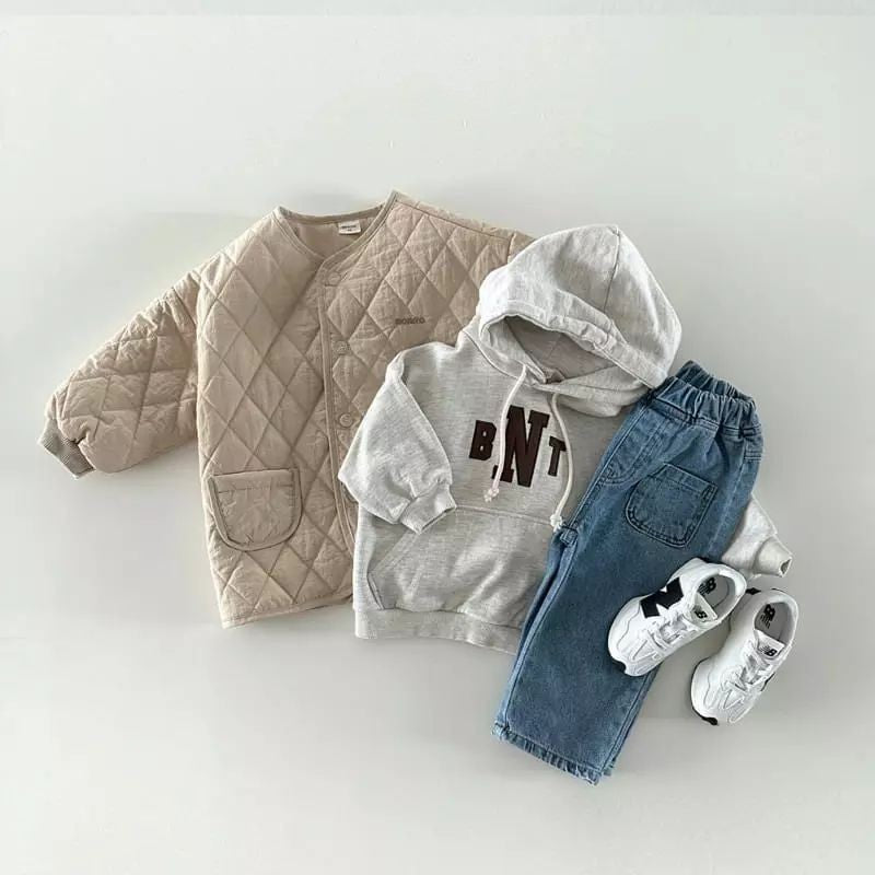 Apricot quilted jacket styled with hoodie and jeans