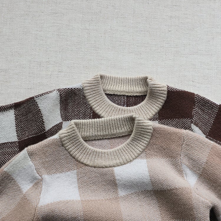 Close-up of the ribbed knit neckline on the gingham romper