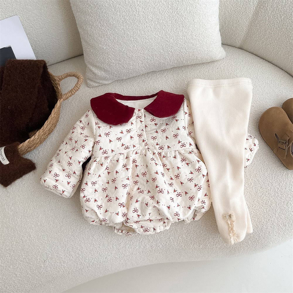 Bow print baby romper styled with cream leggings