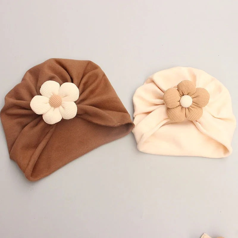 Brown and beige knotted turban beanies with 3D flowers