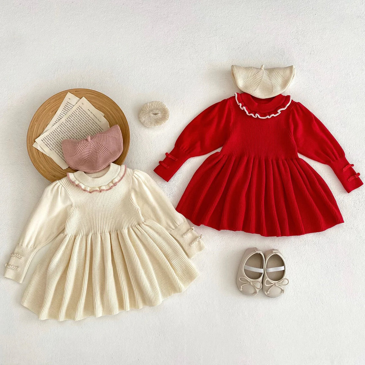 Red and beige baby girl knit sweater dresses with ruffle collars