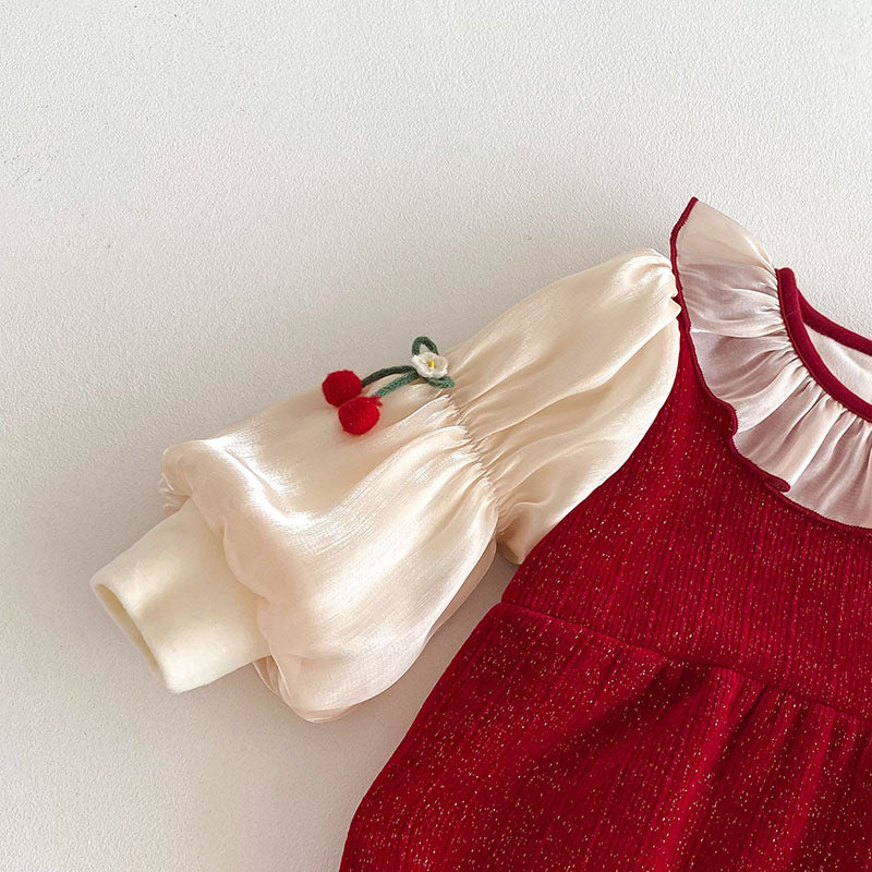 Cream puff sleeve with cherry detail on baby romper