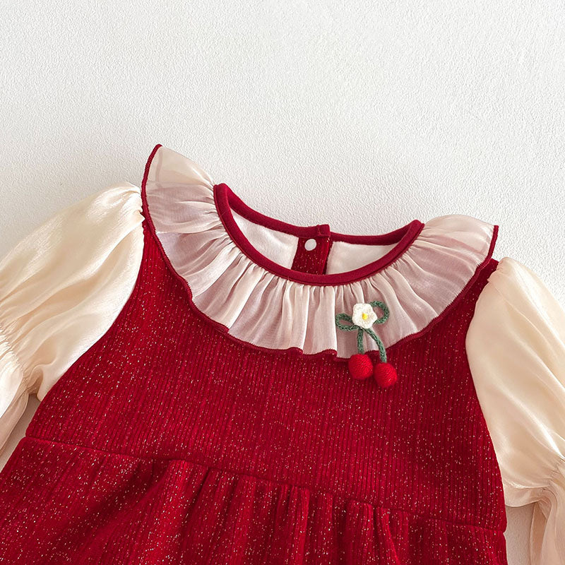 Ruffle collar and cherry brooch on red baby romper