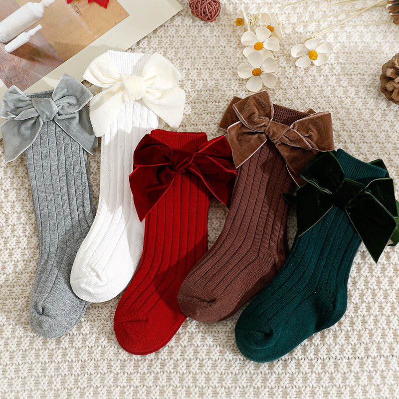 Baby velvet bow knee-high socks in grey, white, red, brown and green