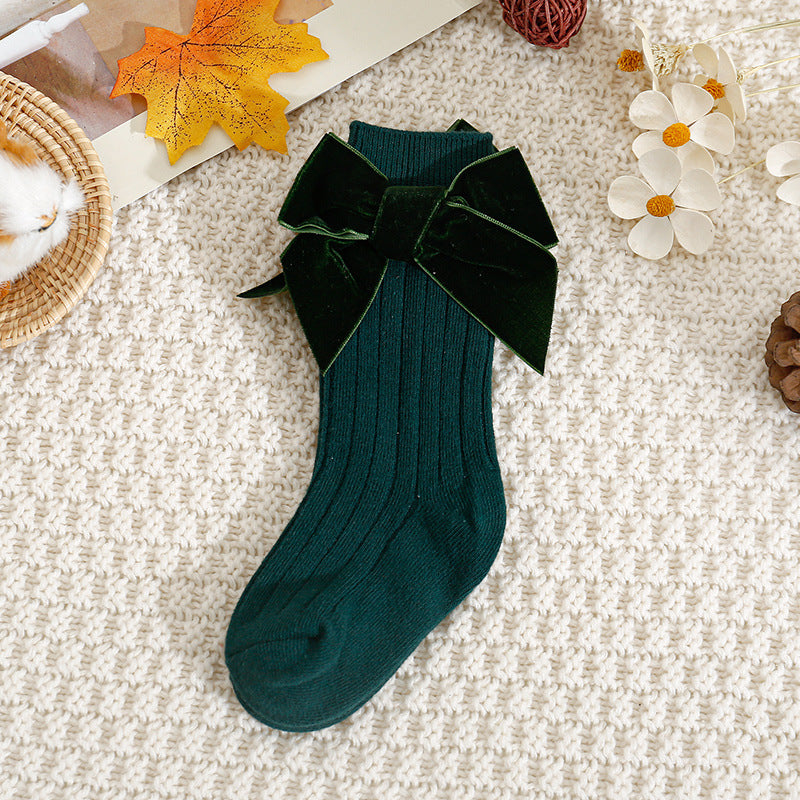 Dark green ribbed knee-high baby socks with velvet bow