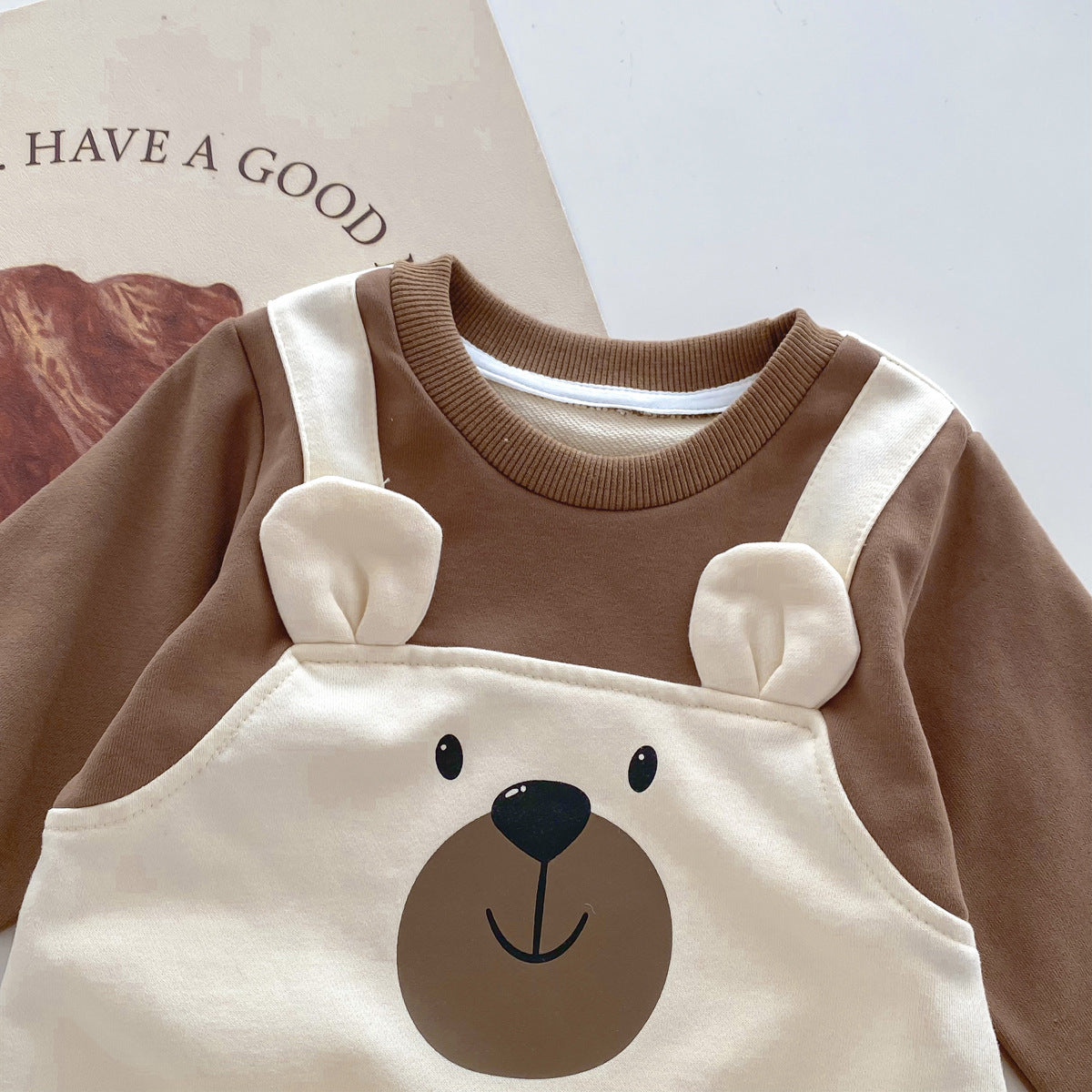 Close-up of bear face on overall bib