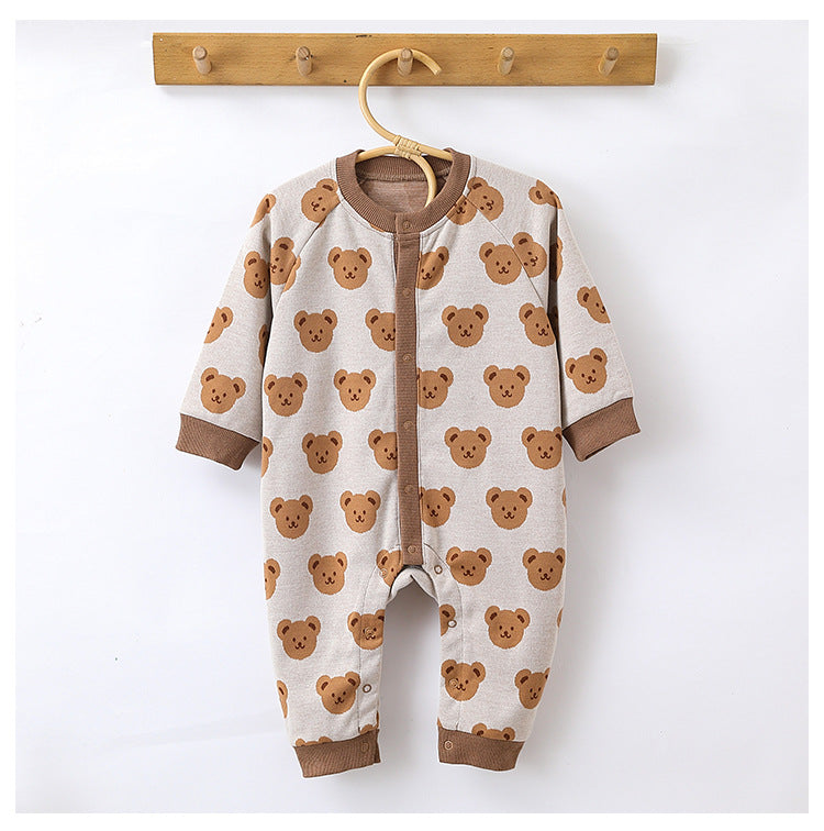 Beige teddy bear knit jumpsuit on a hanger