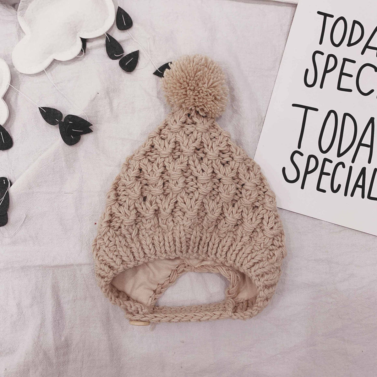 Beige chunky knit pom-pom baby bonnet