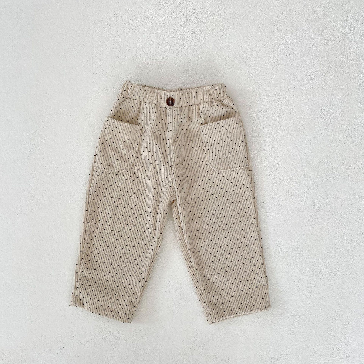Beige corduroy baby trousers with pockets