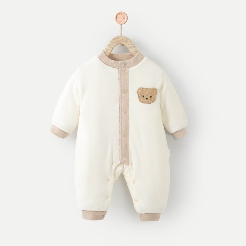 Beige fleece-lined bear baby jumpsuit on a hanger