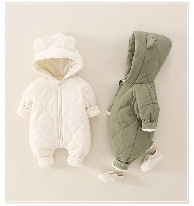 Beige and green quilted rompers side by side
