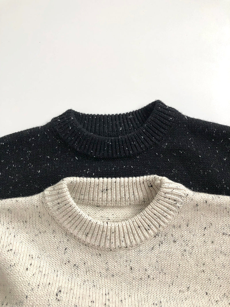 Black and beige speckled knit sweaters necklines