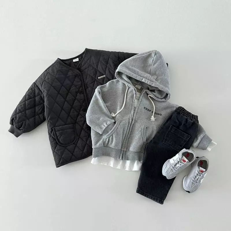 Black quilted jacket outfit laid flat with sneakers