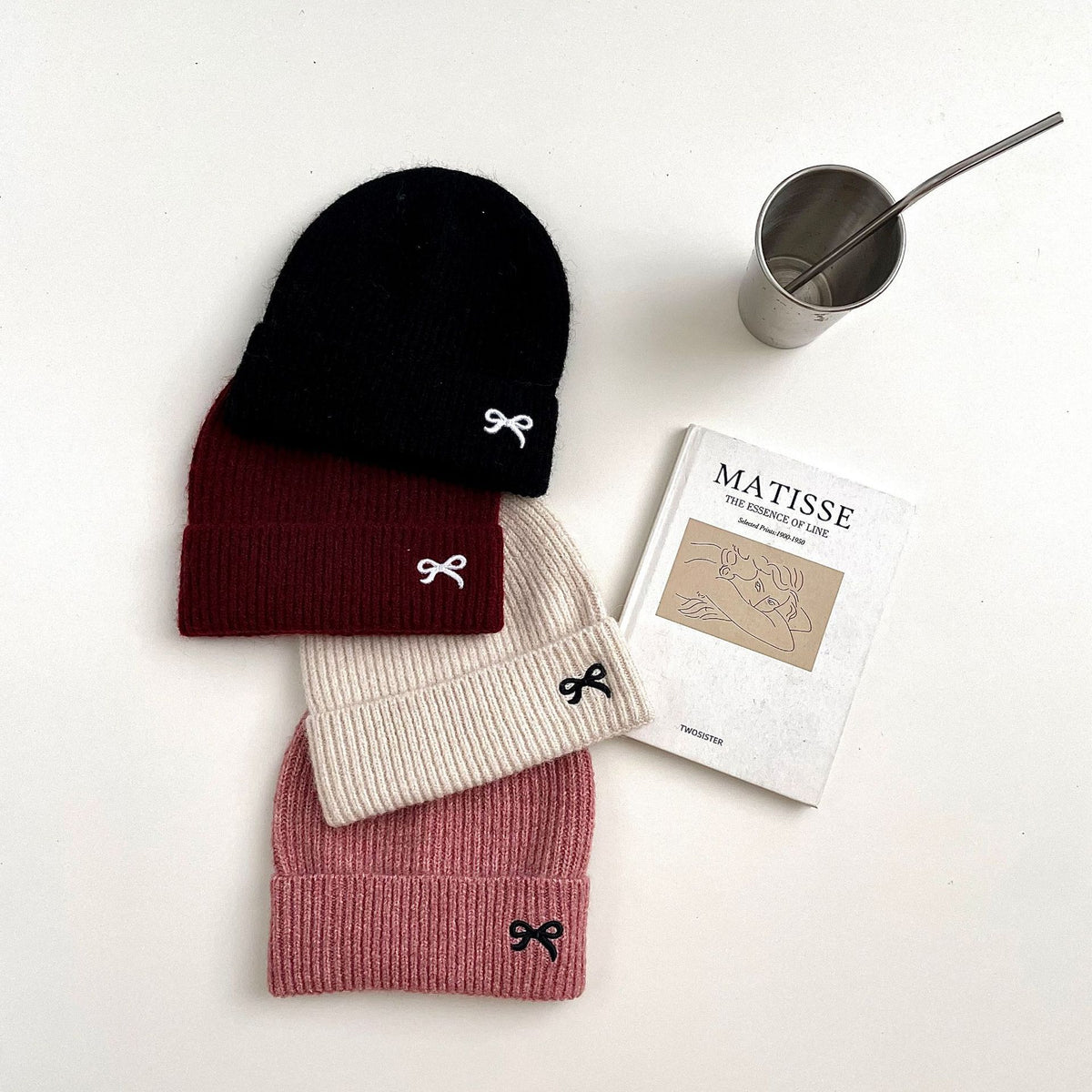Black, red, beige and pink ribbed knit beanies