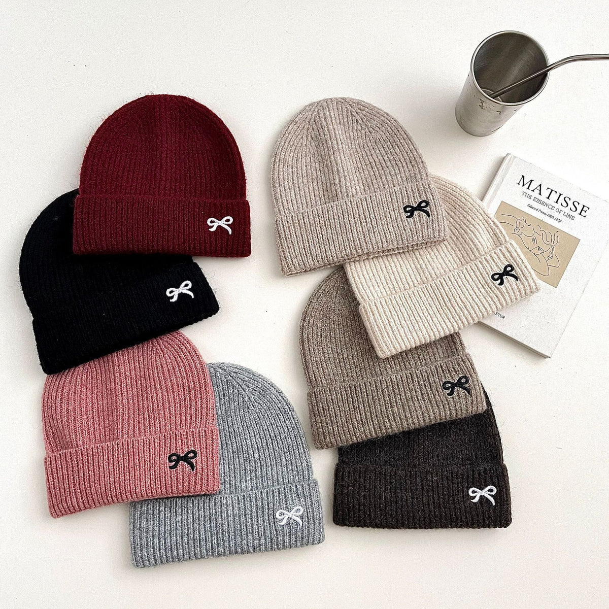 Assorted colour ribbed knit beanies with bow embroidery