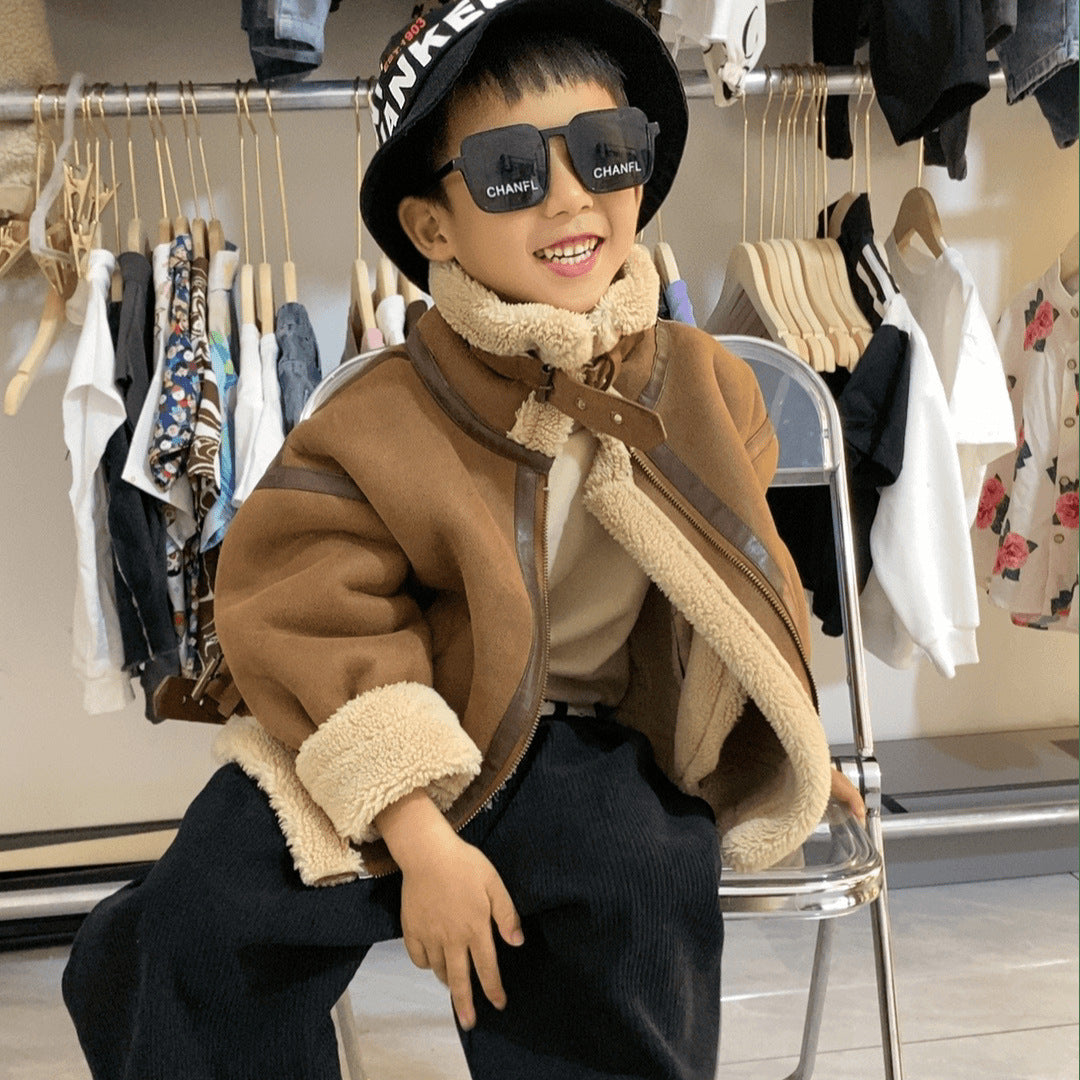 Boy wearing brown shearling aviator jacket and sunglasses