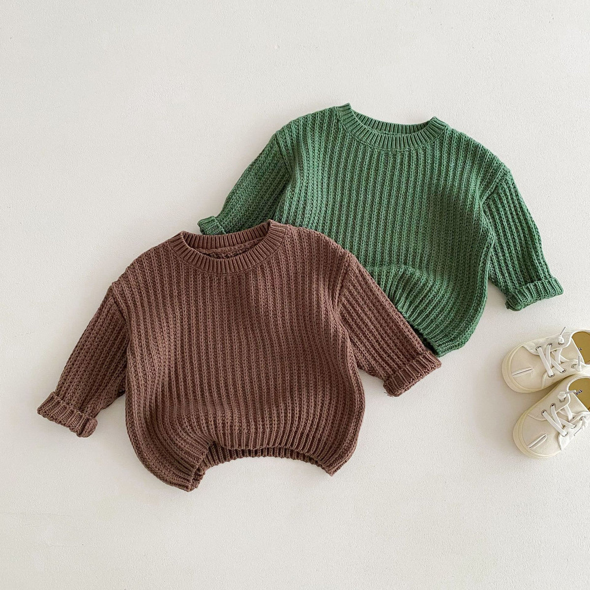 Brown and green chunky knit sweaters with shoes