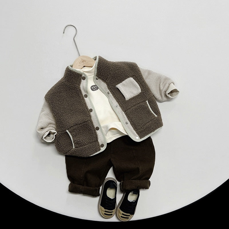Brown teddy fleece jacket on a hanger with outfit