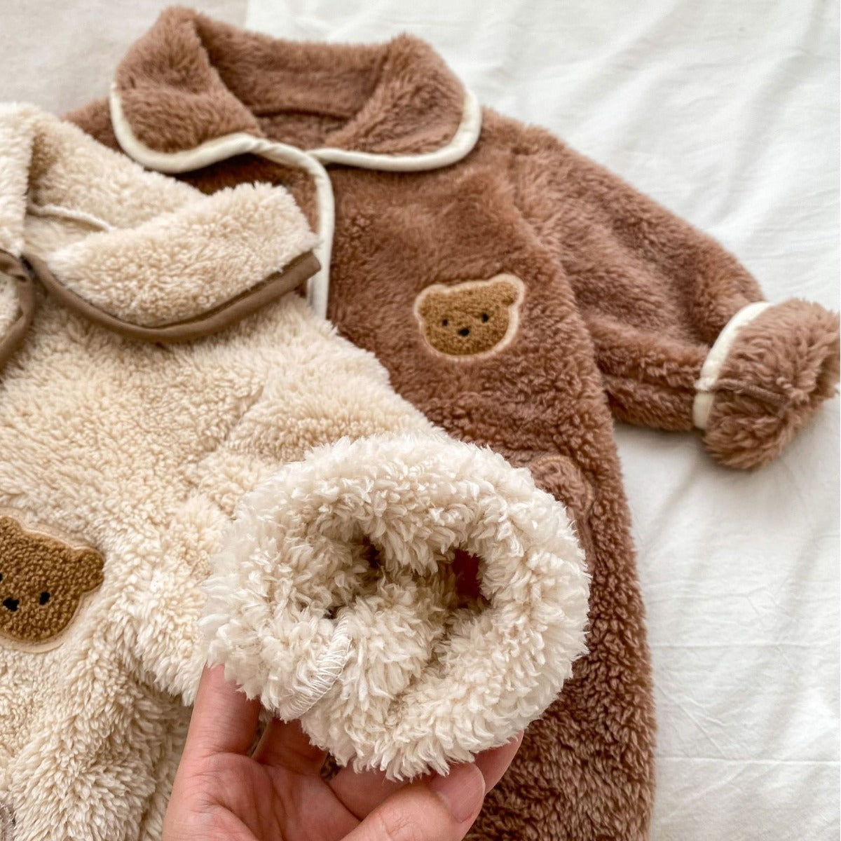 Close-up of fluffy cuff and bear pocket