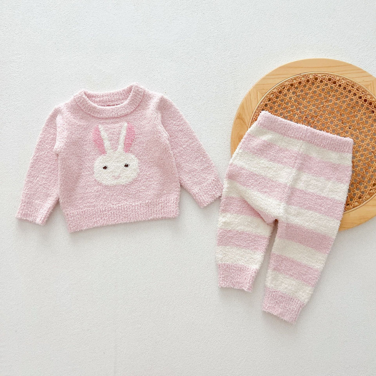 Pink bunny knit sweater with pink and cream striped pants