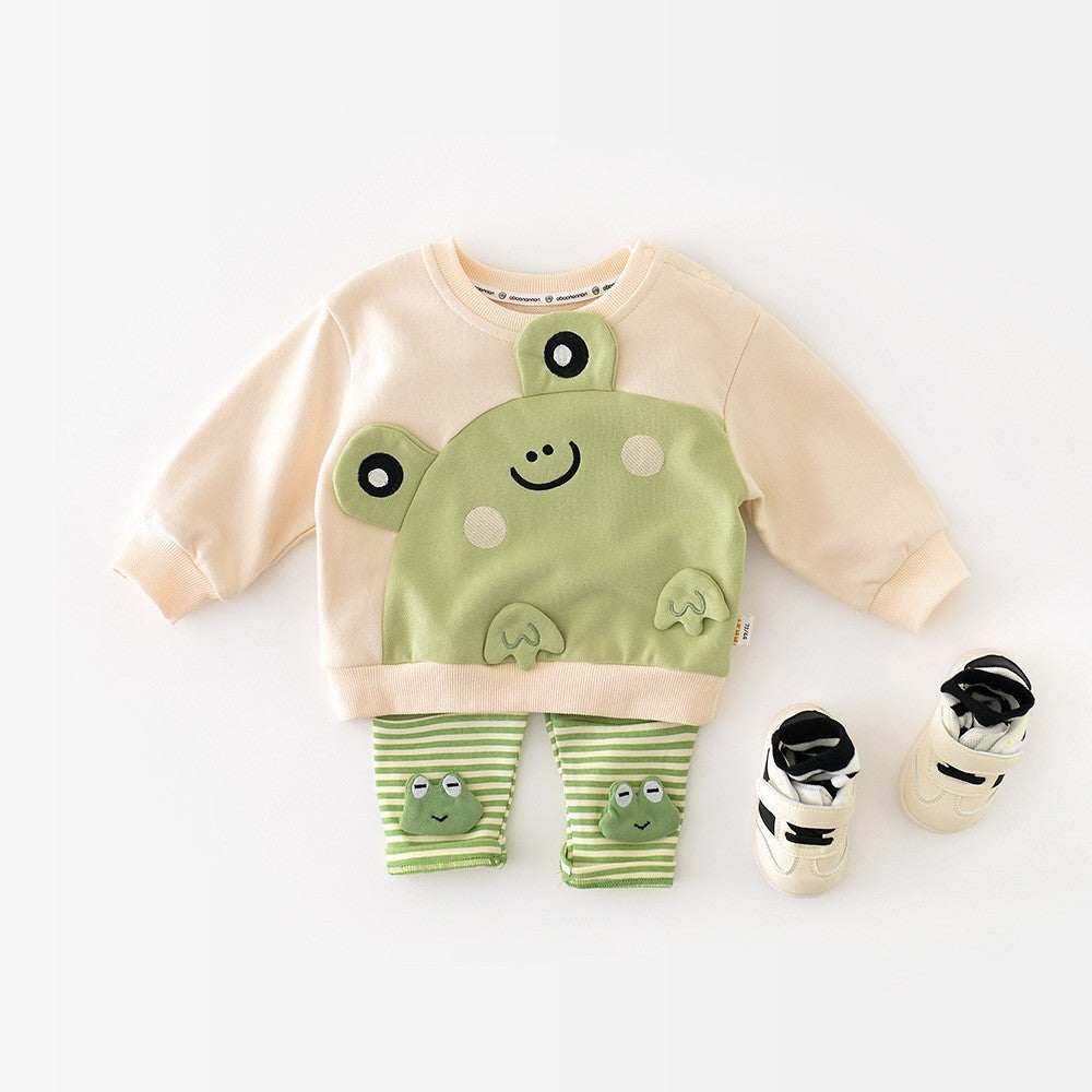 Cream baby sweatshirt with green frog styled with striped pants